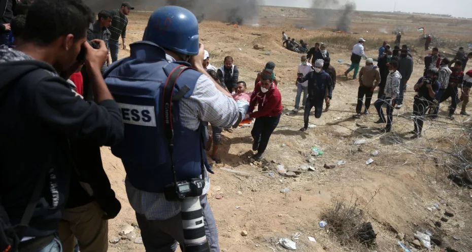 Palestinian journalists reporting 